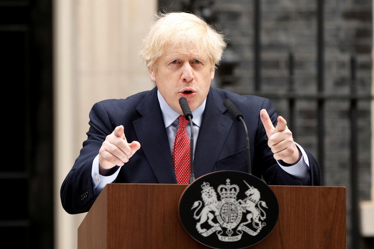The photo shows the prime minister at a podium speaking forcefully.