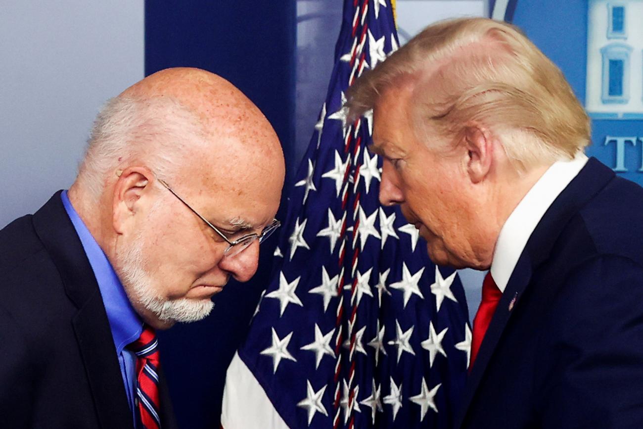 Former CDC Director Robert Redfield and former U.S. President J. Donald Trump on the podium at a COVID-19 task force briefing at the White House, in Washington, DC, on April 22, 2020.
