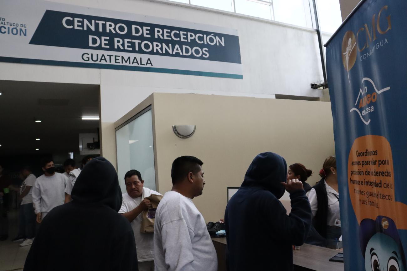 Migrants must fill out paperwork, after being called by their full name, on February 6, 2025.